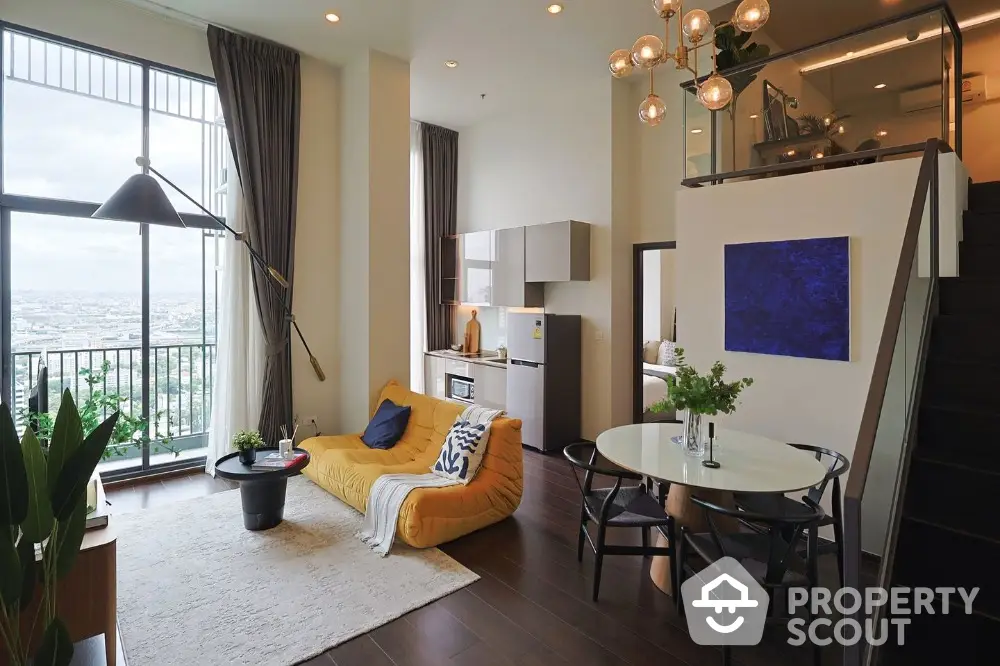 Modern loft apartment with high ceilings and large windows offering stunning city views.