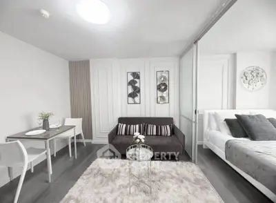 Modern studio apartment with cozy living area and stylish decor