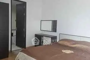 Cozy bedroom with modern furniture and ensuite bathroom