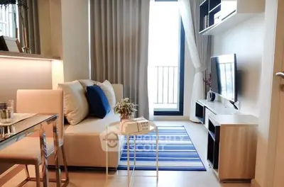 Modern living room with stylish decor and balcony view