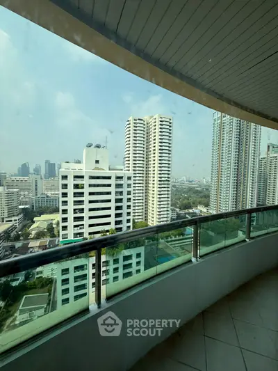 Stunning high-rise balcony view of city skyline with modern architecture.