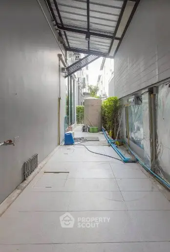 Spacious exterior corridor with modern design and natural light