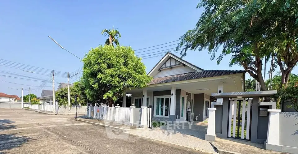 Charming suburban house with lush greenery and modern design, perfect for family living.
