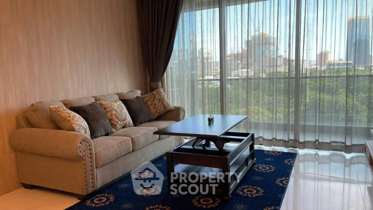 Elegant living room with city view, featuring a cozy sofa and stylish coffee table.