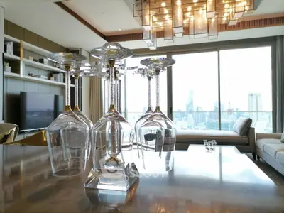 Luxurious living room with stunning city view and elegant chandelier