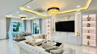 Luxurious modern living room with elegant chandelier and spacious seating area