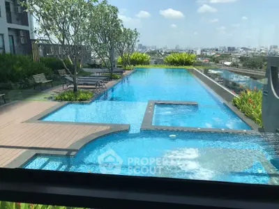 Luxurious rooftop pool with stunning city view and lush greenery