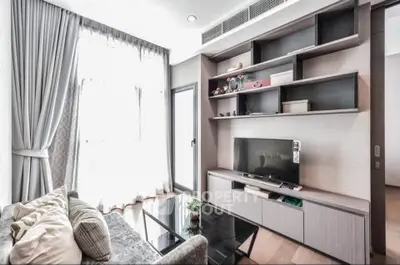 Modern living room with sleek entertainment unit and large window