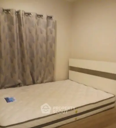 Cozy bedroom with modern decor and comfortable mattress, perfect for restful nights.