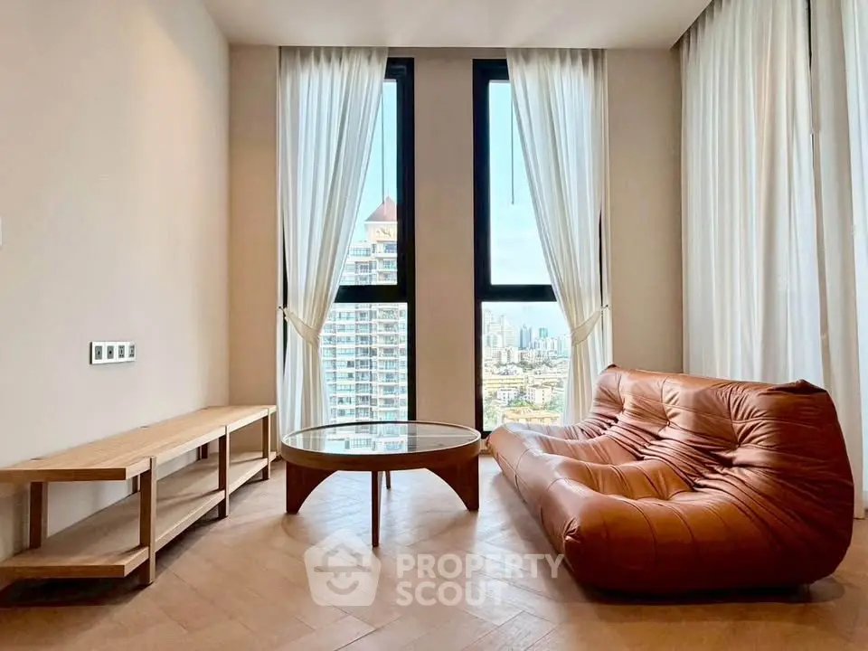 Stylish living room with modern furniture and city view, perfect for urban living.