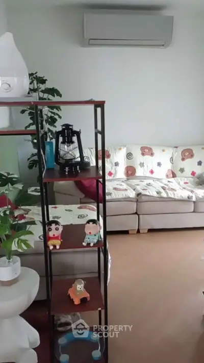 Cozy living room with plush sofa and decorative shelving unit