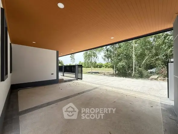 Spacious open garage with modern design and scenic outdoor view