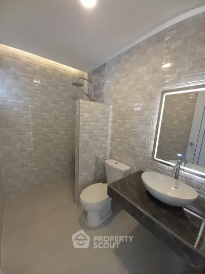 Modern bathroom with sleek tiles and stylish fixtures