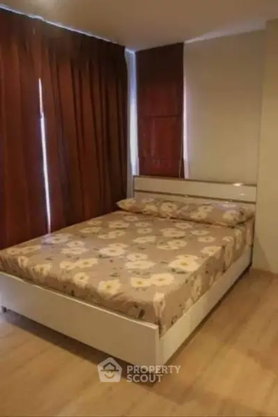 Cozy bedroom with floral bedding and warm lighting