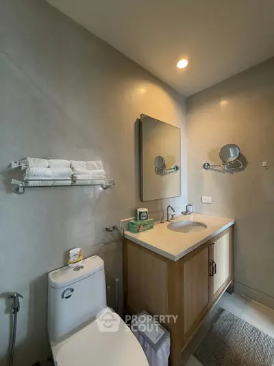 Modern bathroom with elegant fixtures and ample storage space