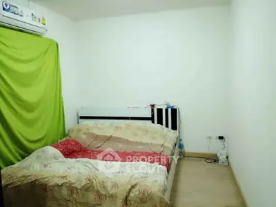 Cozy bedroom with air conditioning and simple decor, perfect for restful nights.