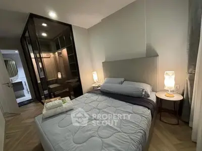 Modern bedroom with cozy lighting and walk-in closet in a stylish apartment.