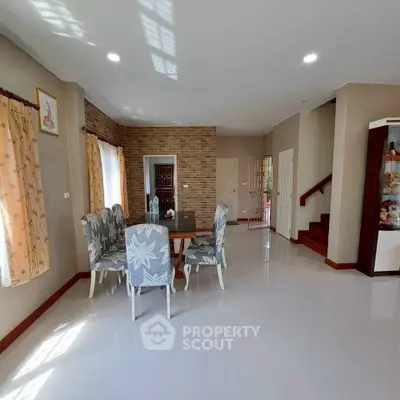 Spacious living room with elegant dining area and modern decor