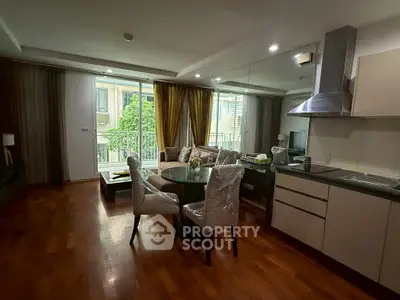 Modern living room with dining area and balcony view in stylish apartment