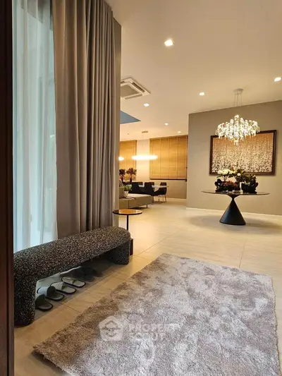 Luxurious modern living room with elegant decor and chandelier