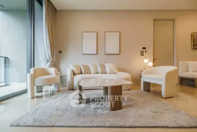 Luxurious modern living room with elegant furniture and large windows