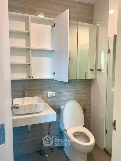 Modern bathroom with sleek fixtures and ample storage space