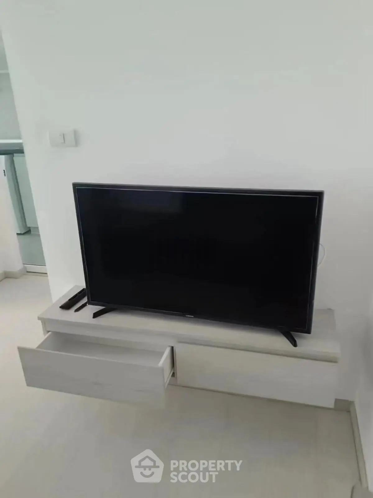 Modern living room with sleek TV unit and minimalist design