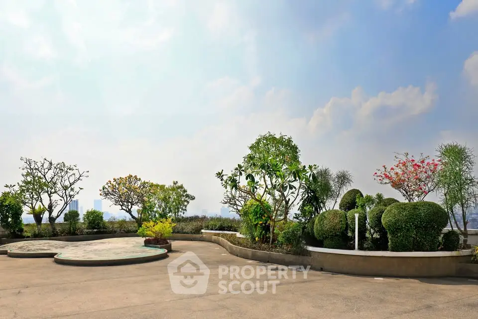 Stunning rooftop garden with panoramic city views and lush greenery.