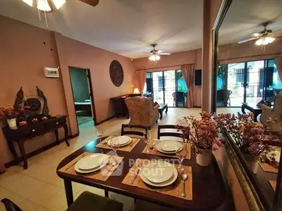 Spacious living room with elegant dining area and large windows for natural light.