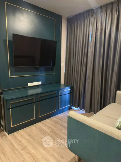 Modern living room with stylish TV setup and elegant curtains