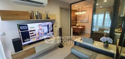 Modern living room with TV and dining area in open layout apartment