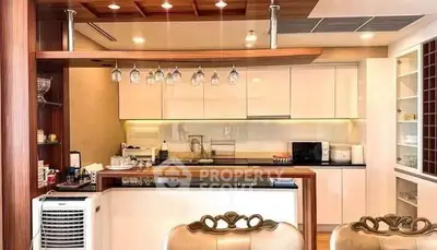 Luxurious modern kitchen with elegant lighting and sleek cabinetry, perfect for gourmet cooking.