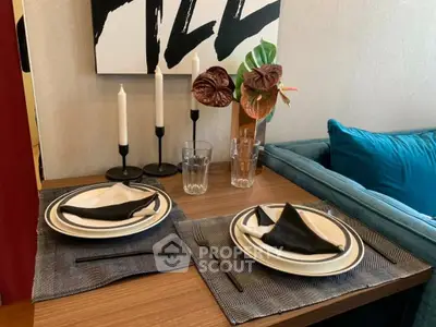 Stylish dining setup with elegant tableware and modern decor in a cozy living space.