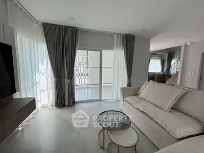 Spacious modern living room with elegant decor and natural light