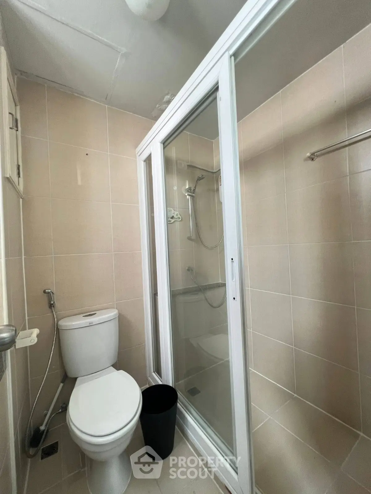 Compact bathroom with shower enclosure and modern fixtures