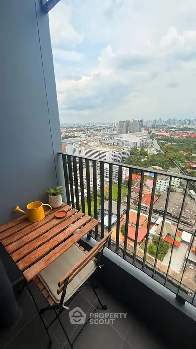 Charming balcony with cityscape view, perfect for relaxation and enjoying urban living.