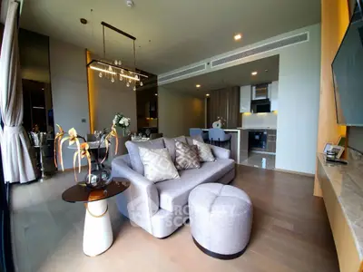 Luxurious modern living room with open kitchen and elegant decor