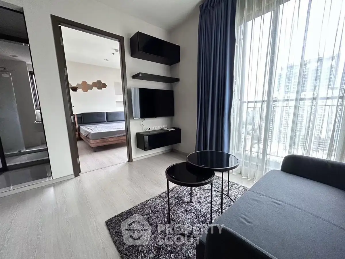 Modern living room with balcony view and stylish furniture