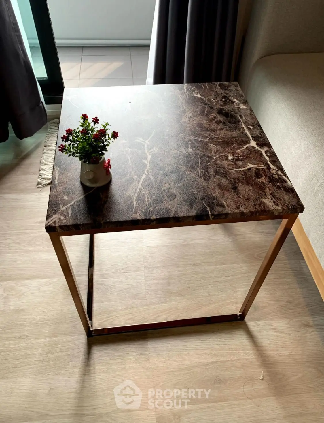 Modern interior with elegant marble side table and small plant decor