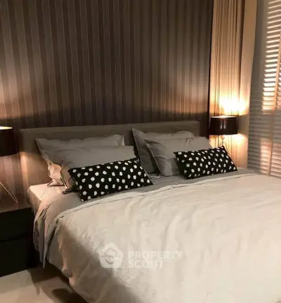 Cozy modern bedroom with stylish decor and ambient lighting, perfect for relaxation and comfort.