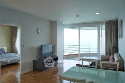 Spacious living room with ocean view balcony in modern apartment