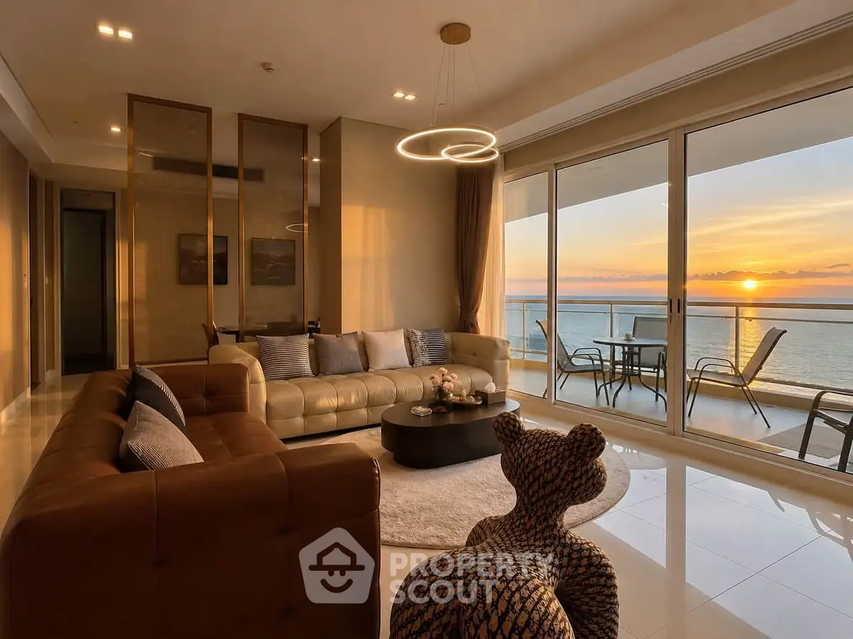 Luxurious living room with stunning ocean view and modern decor, featuring elegant furniture and large balcony.