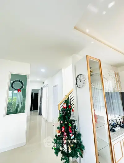 Bright and modern living space with festive decor and sleek design elements.