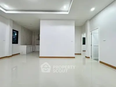 Spacious modern living area with sleek design and open layout, perfect for contemporary living.