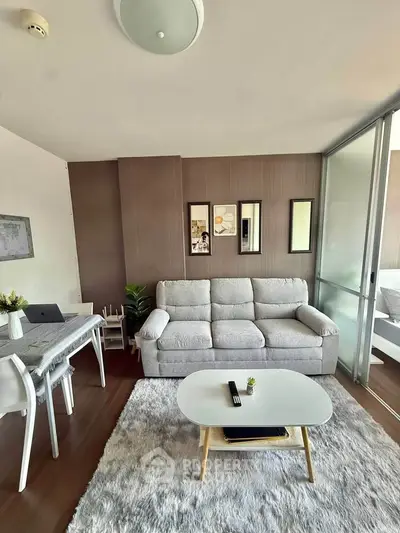 Modern living room with cozy sofa and stylish decor in a bright apartment.