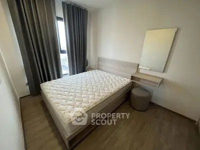 Modern minimalist bedroom with large window and stylish furniture