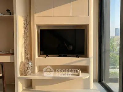 Modern living room with built-in TV unit and large window view