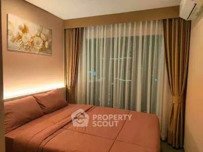 Cozy bedroom with elegant curtains and soft lighting, perfect for relaxation.