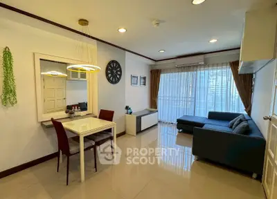 Modern living room with stylish decor and large windows offering city views