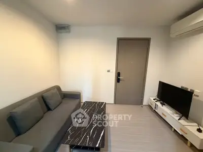 Modern living room with sleek furniture and air conditioning